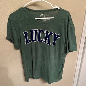 It’s a green lucky brand tee shirt! Size small